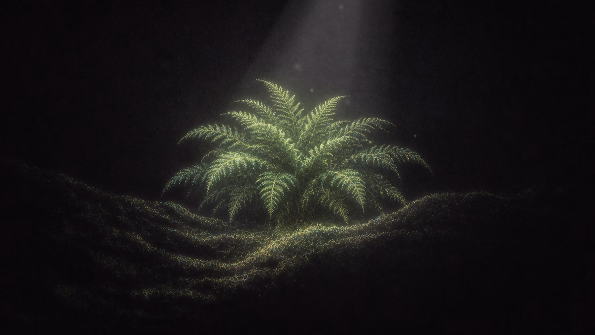 A glowing green fern lit by a single beam of light in a dark space.